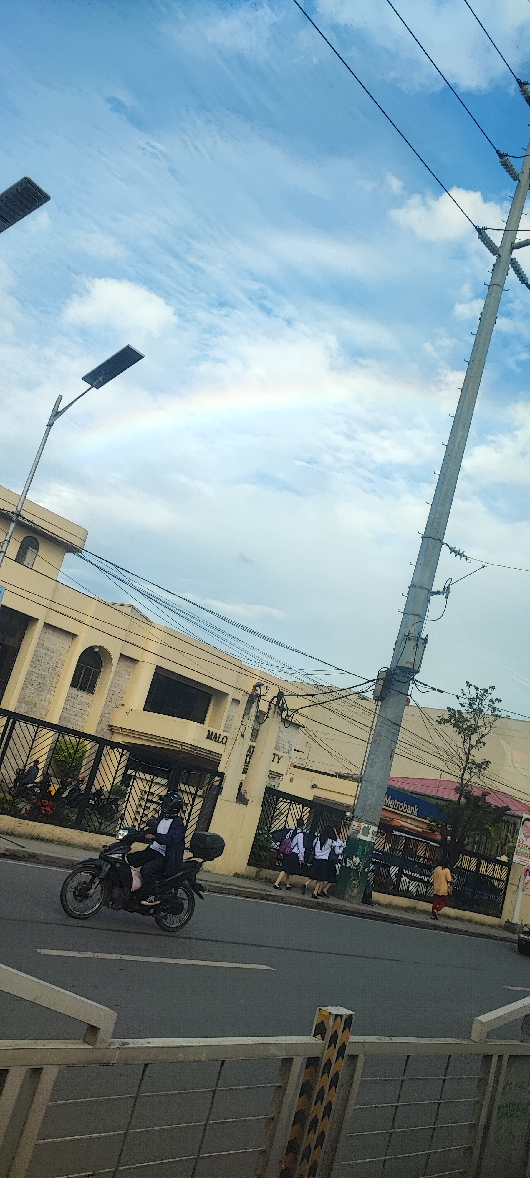 Picture taken of a faint rainbow while traveling.